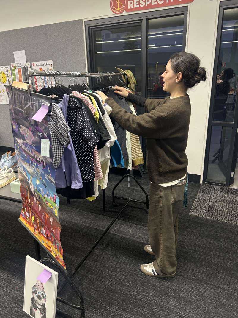 Alanah sorting the bargains at the WHS Community Sale