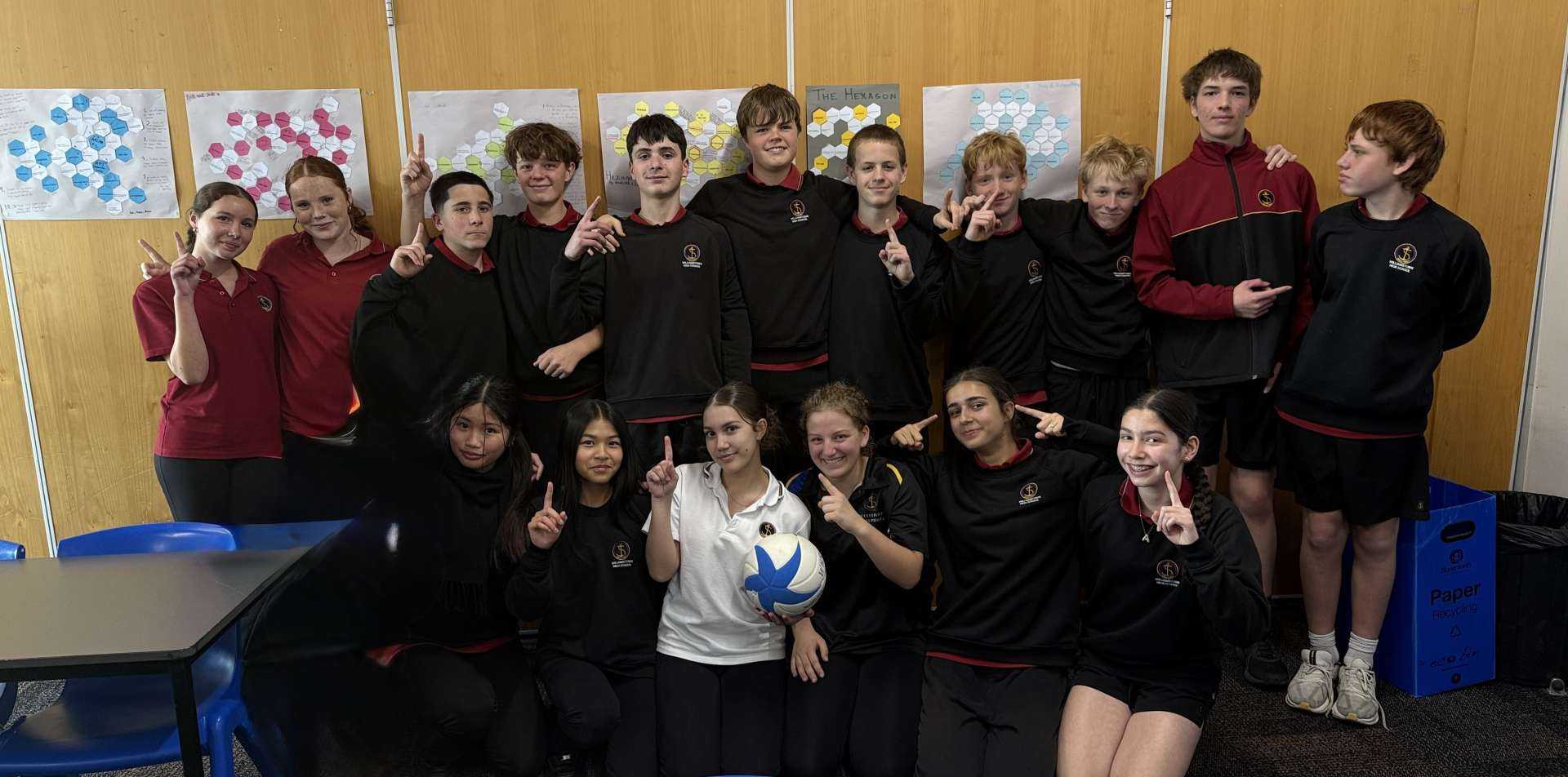 Students from 8I celebrating their homegroup volleyball competition win.