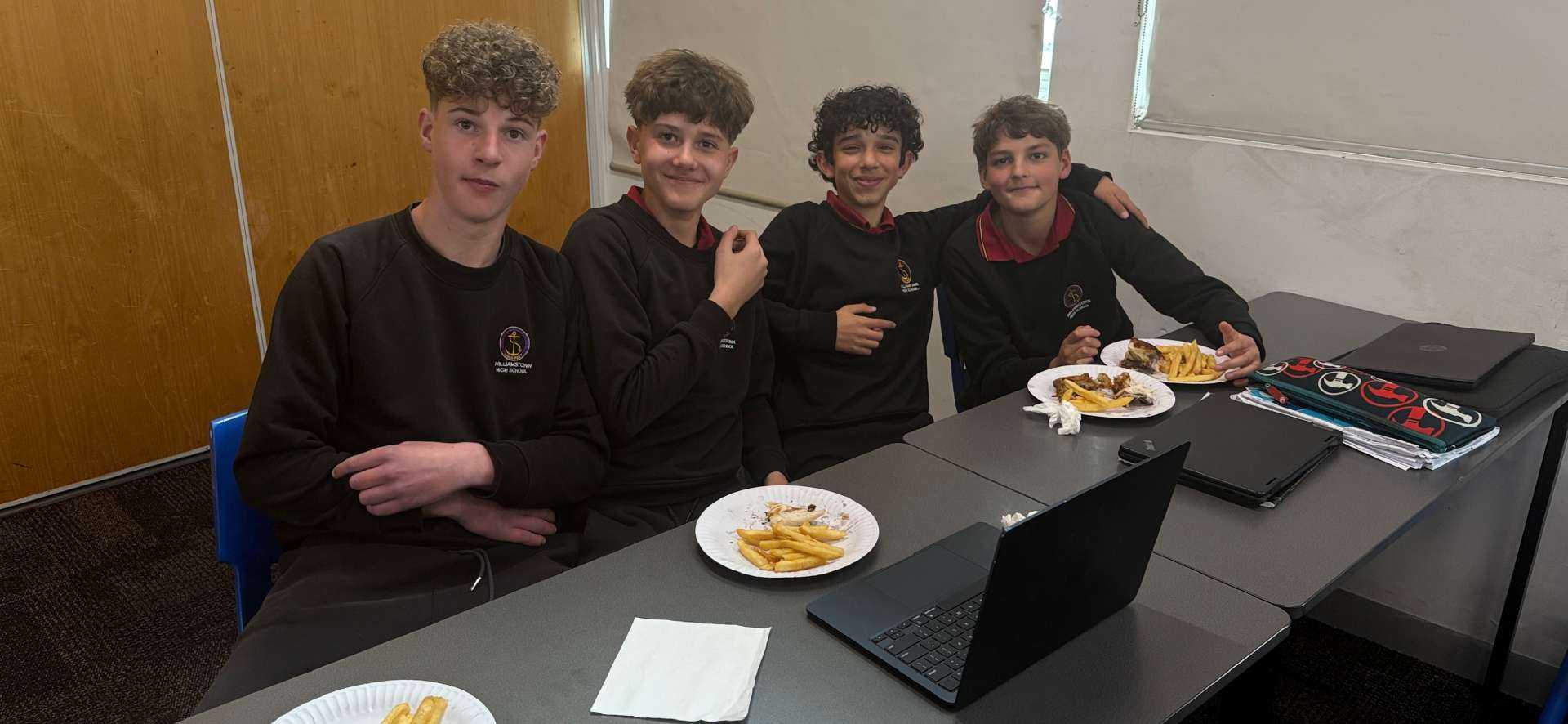Students of 8D enjoying their prize from the AFL Tipping Competition win.