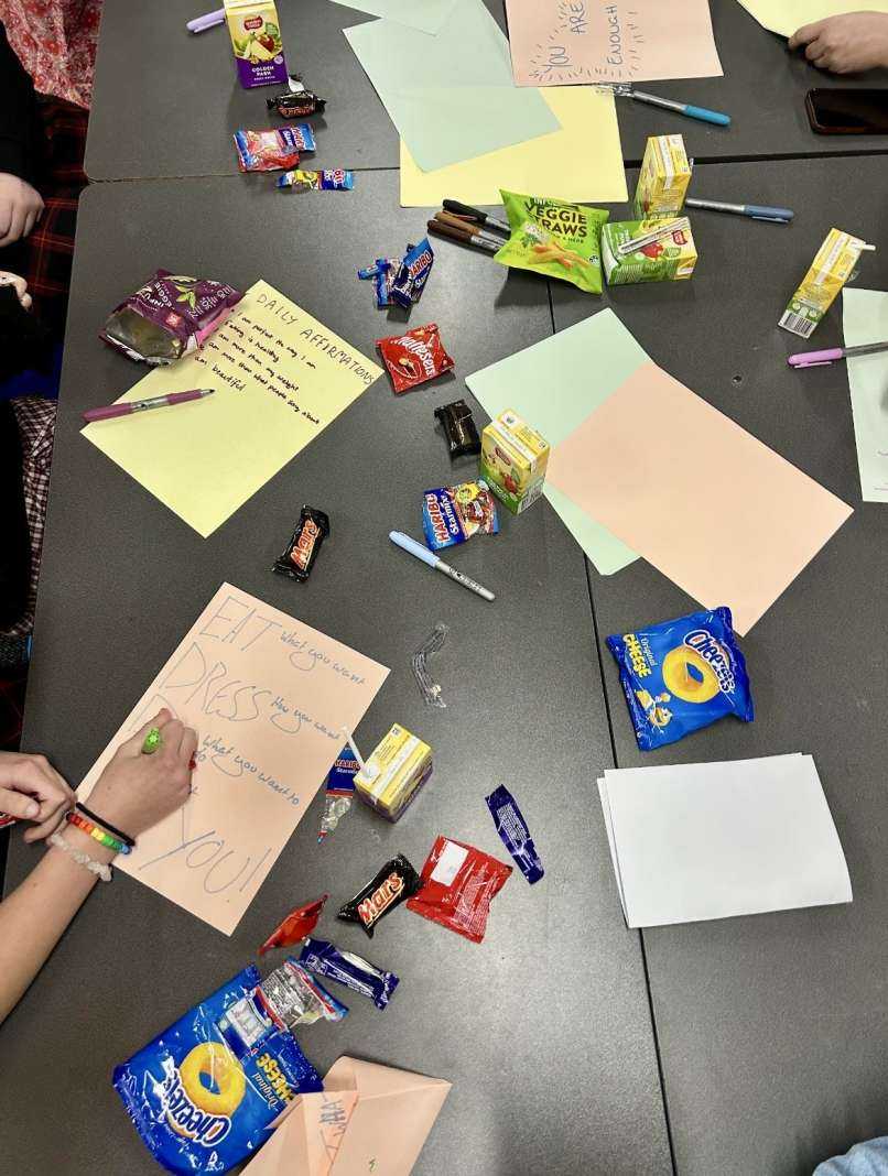 Students sharing written reflections on positive self talk and messages of encouragement to others