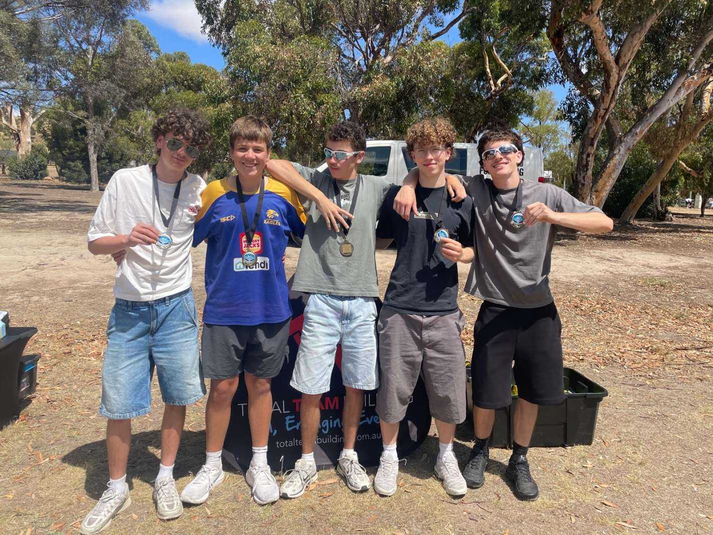 A victorious group of Year 12 students at camp